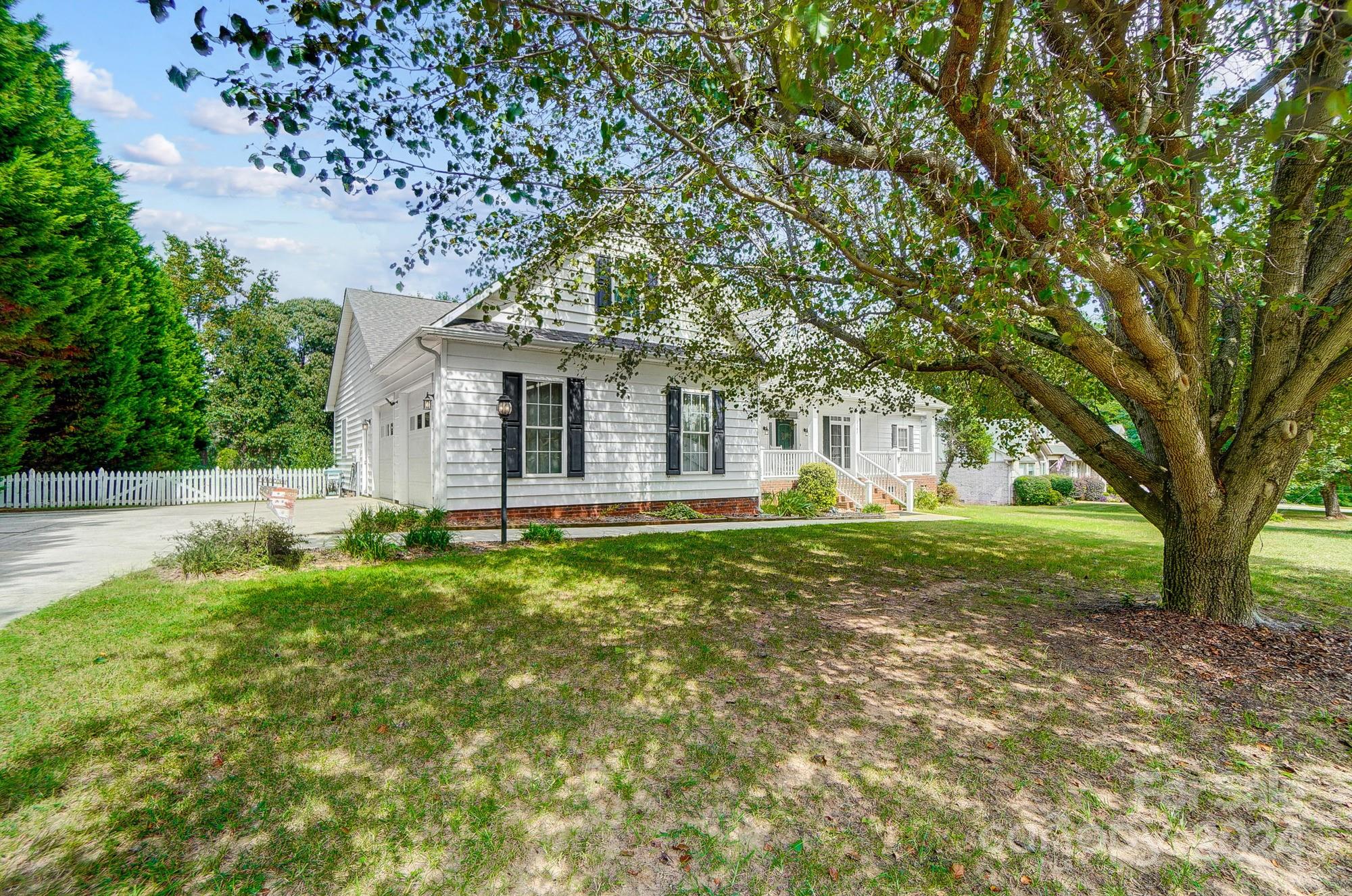 8387 Fairfield Forest Road Denver, NC 28037 - Photo 2 of 38 a view of a house with yard and tree s