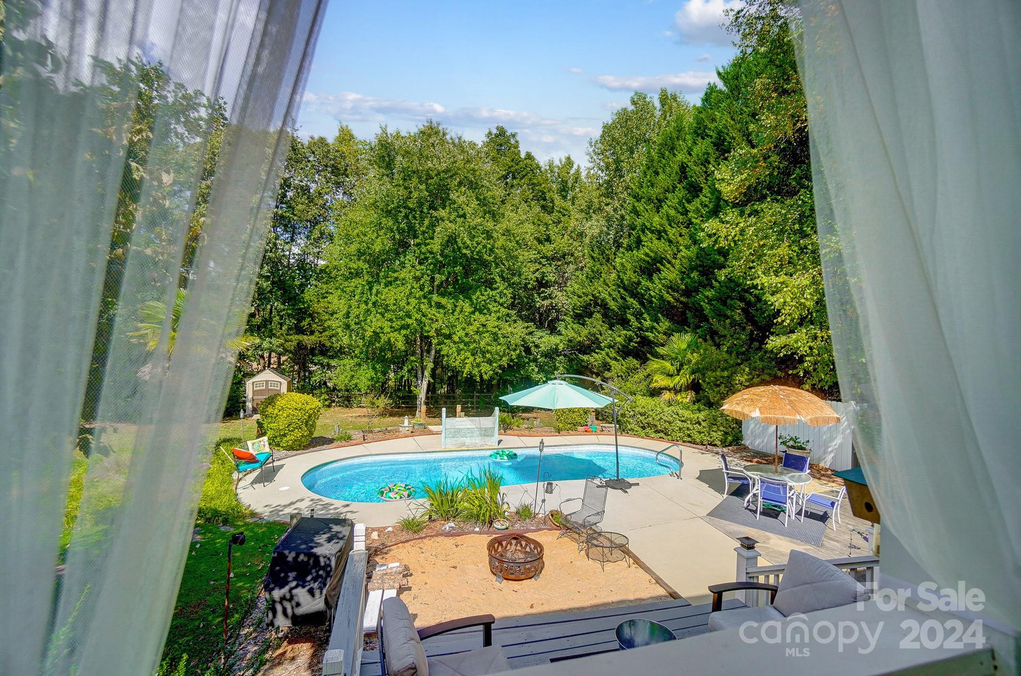8387 Fairfield Forest Road Denver, NC 28037 - Photo 30 of 38 swimming pool view with seating space