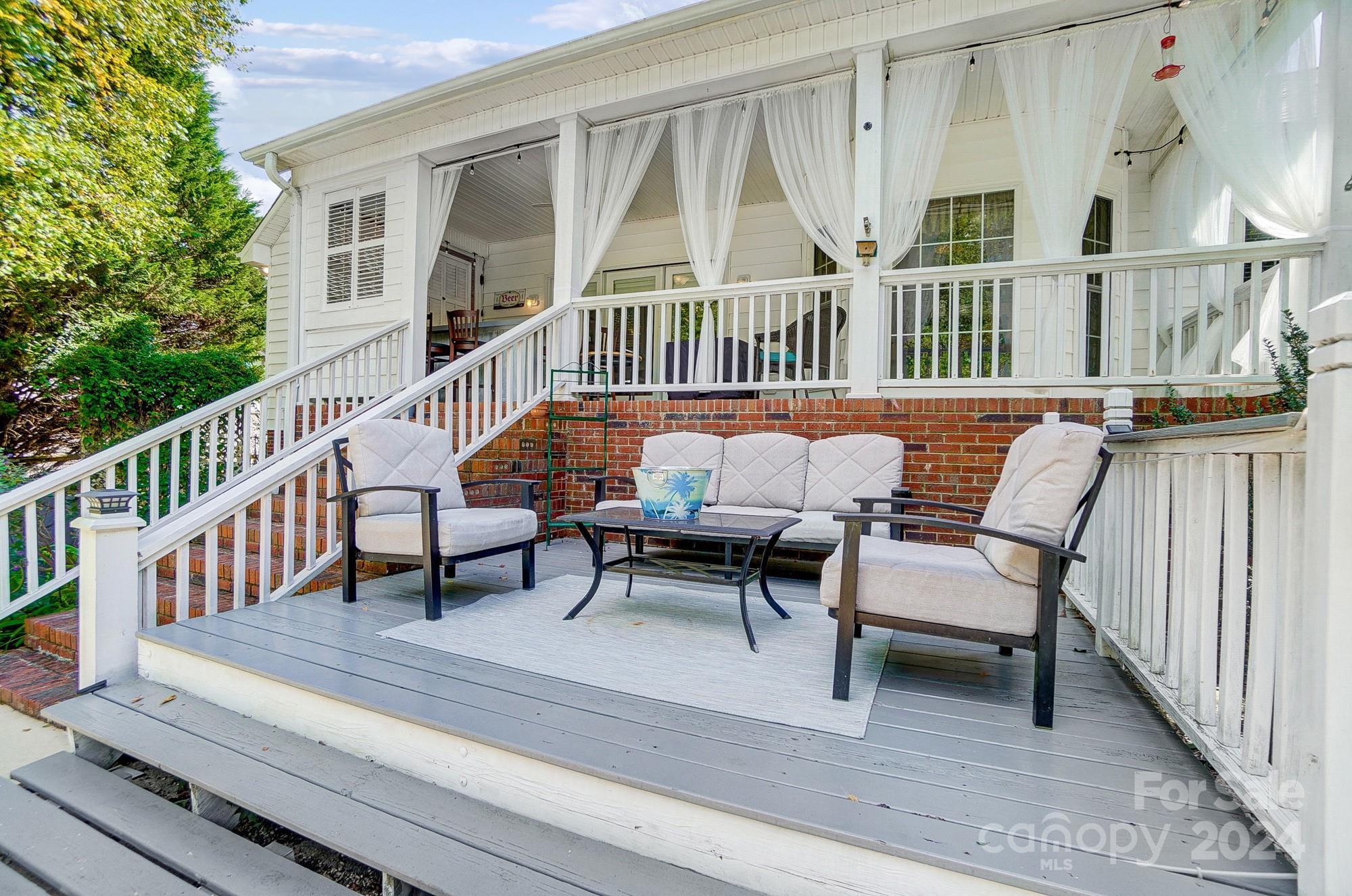 8387 Fairfield Forest Road Denver, NC 28037 - Photo 32 of 38 a balcony with furniture and a gate