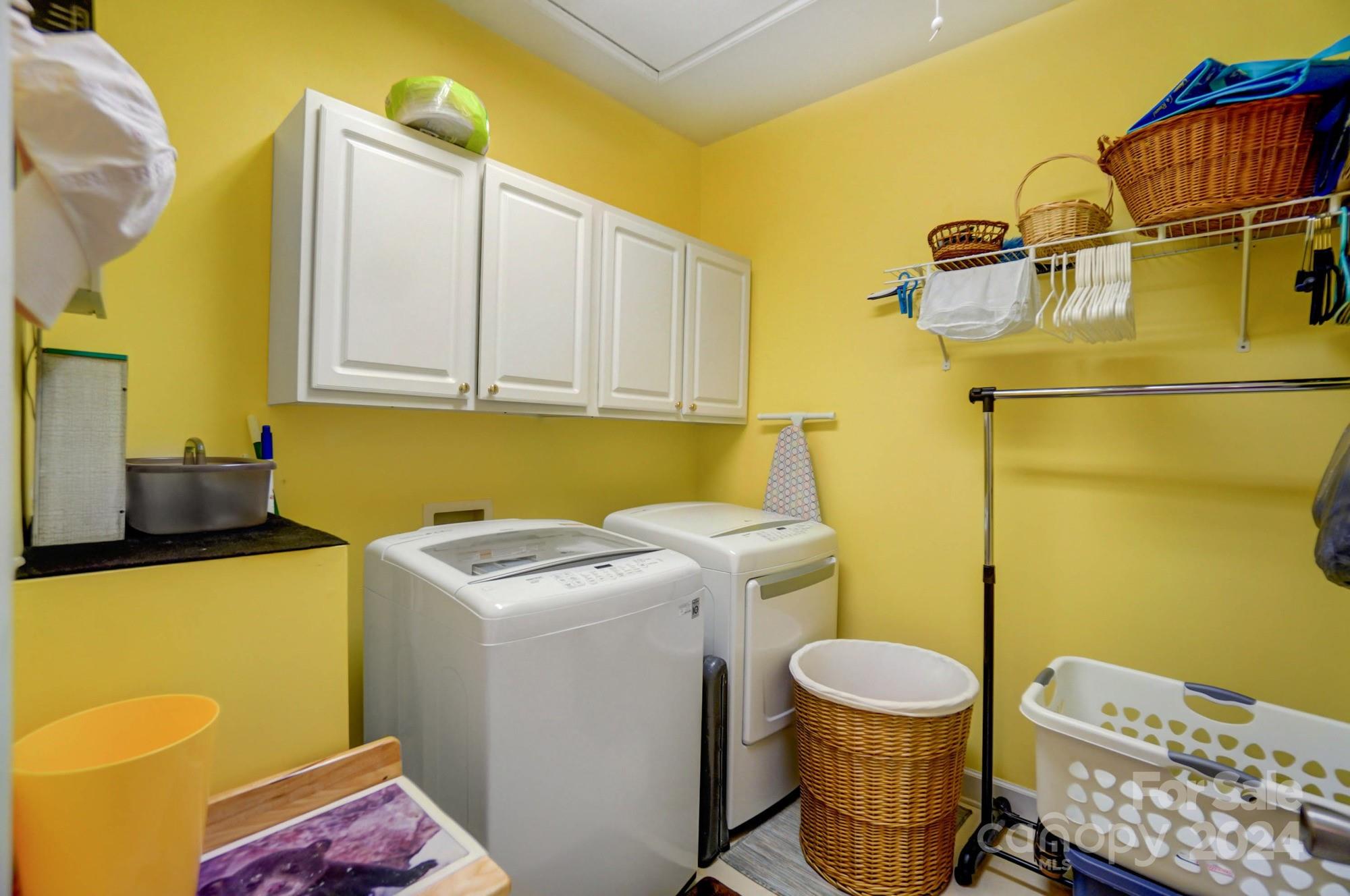 8387 Fairfield Forest Road Denver, NC 28037 - Photo 37 of 38 a utility room with dryer and washer