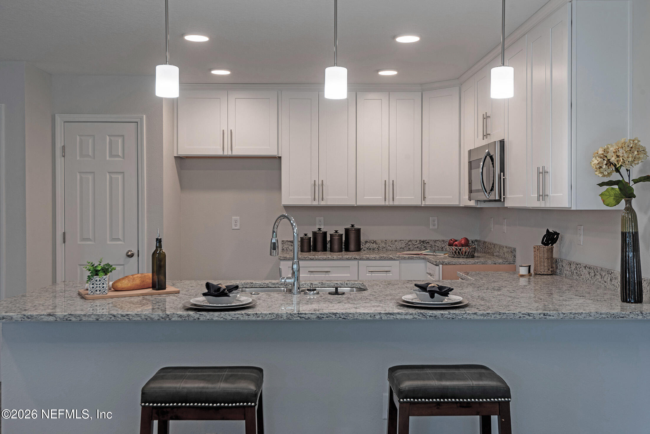 13611 Benton Street Jacksonville, FL 32218 - Photo 17 of 32 a kitchen with a sink and cabinets