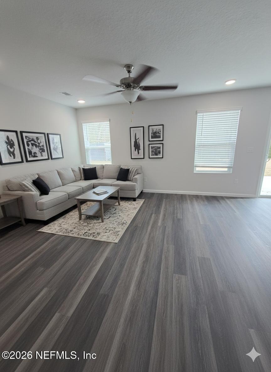 13611 Benton Street Jacksonville, FL 32218 - Photo 2 of 32 a living room with furniture and a wooden floor