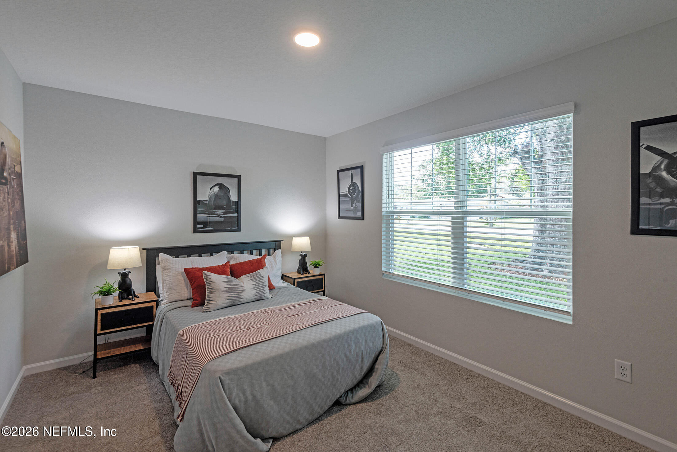 13611 Benton Street Jacksonville, FL 32218 - Photo 27 of 32 a bedroom with a bed and a window