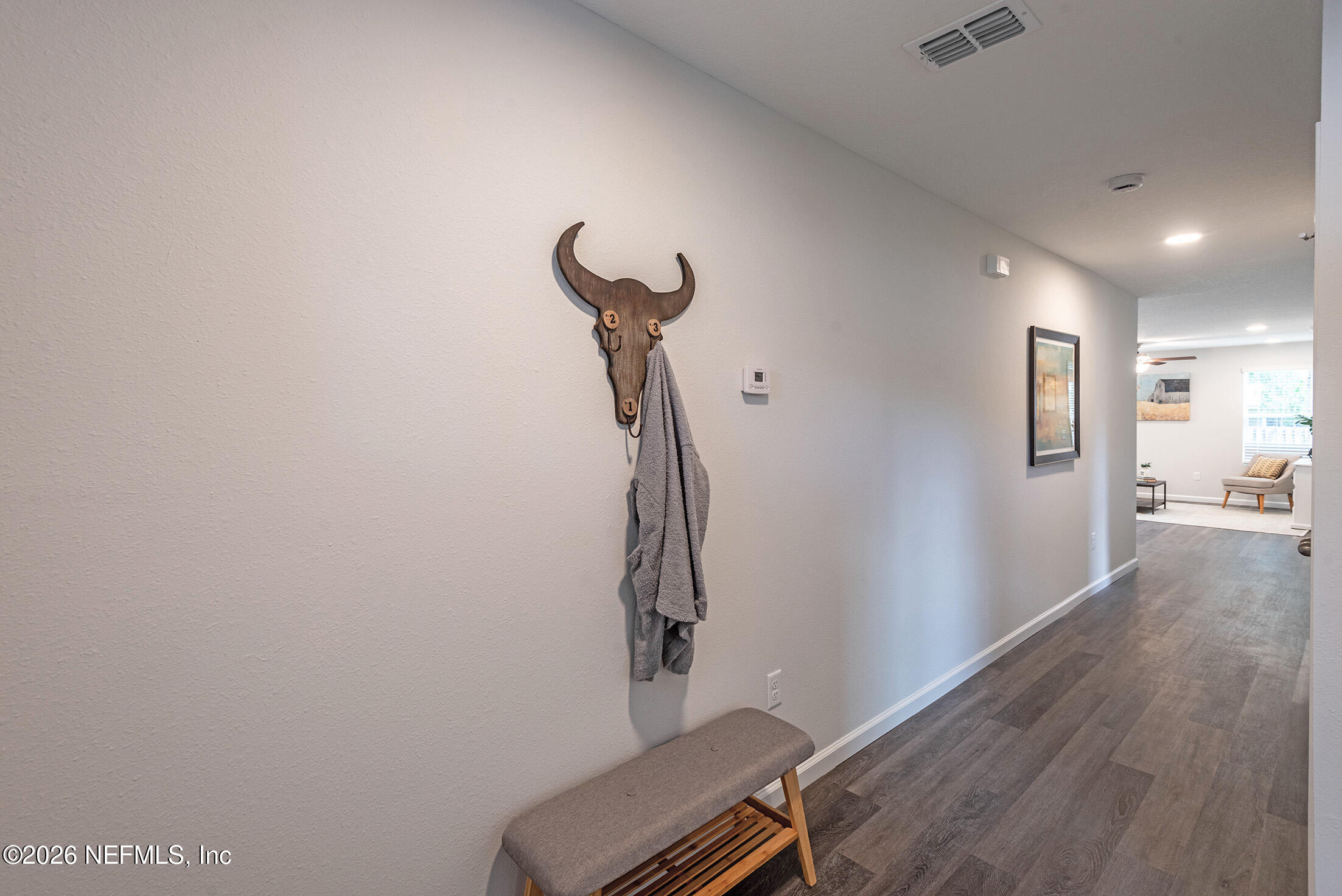 13611 Benton Street Jacksonville, FL 32218 - Photo 28 of 32 a room with gym equipment and wooden floor