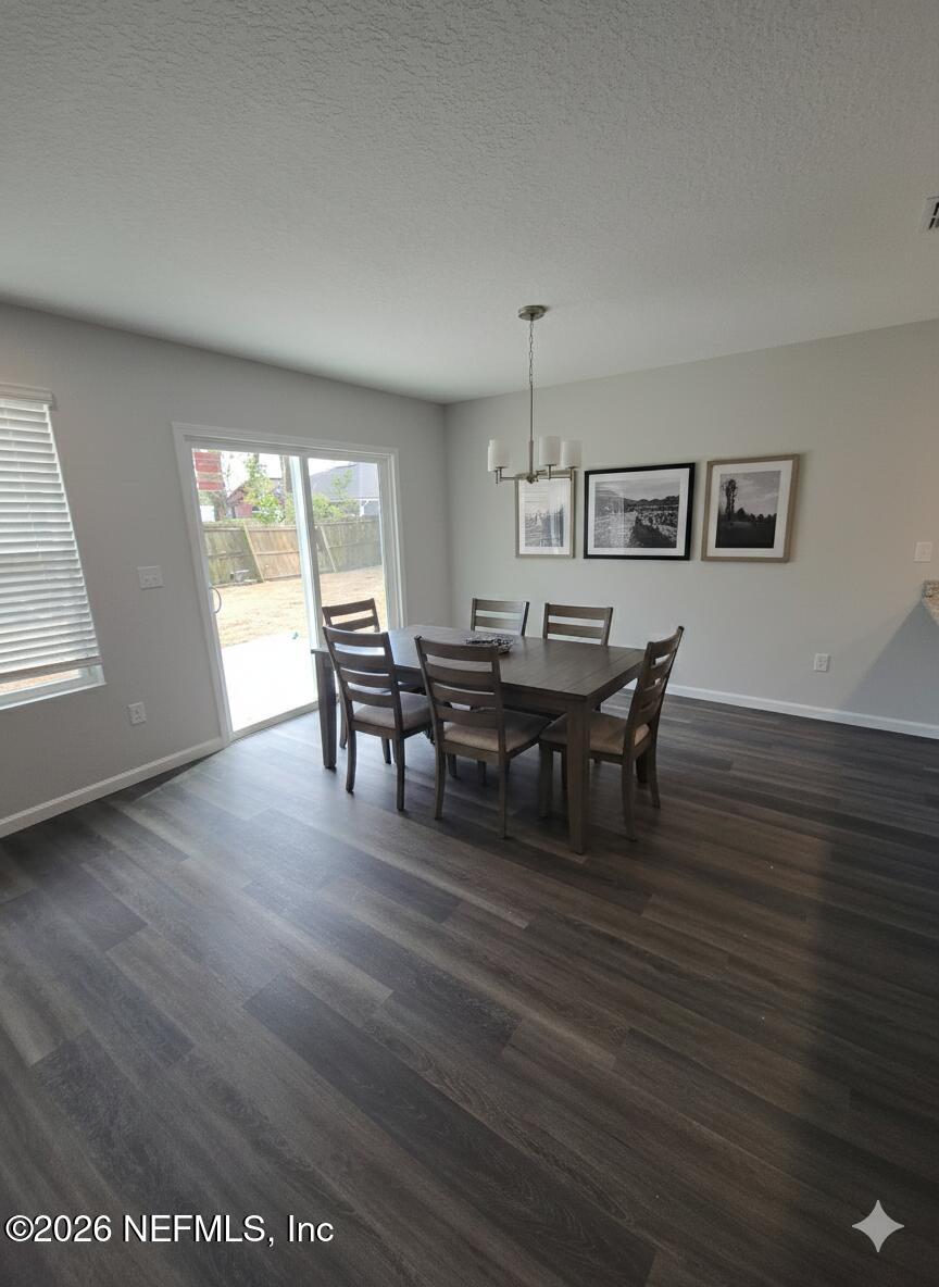 13611 Benton Street Jacksonville, FL 32218 - Photo 3 of 32 a view of a dining room with furniture and window