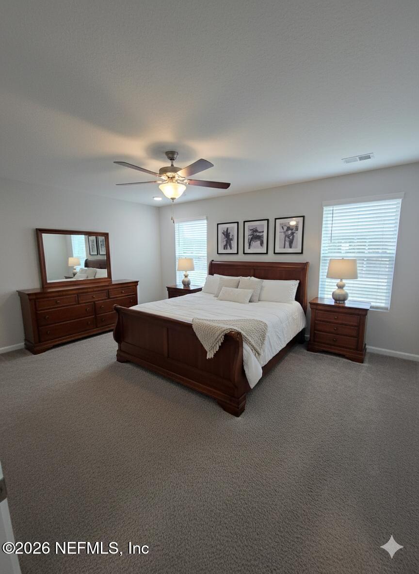 13611 Benton Street Jacksonville, FL 32218 - Photo 4 of 32 a spacious bedroom with a bed and window