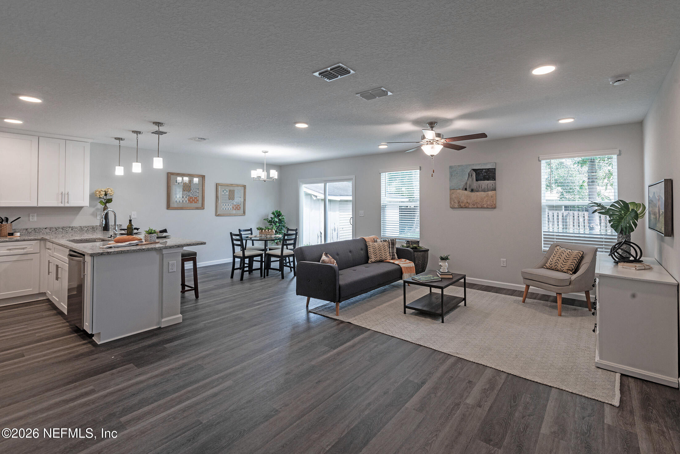 13611 Benton Street Jacksonville, FL 32218 - Photo 9 of 32 a living room with furniture and kitchen view