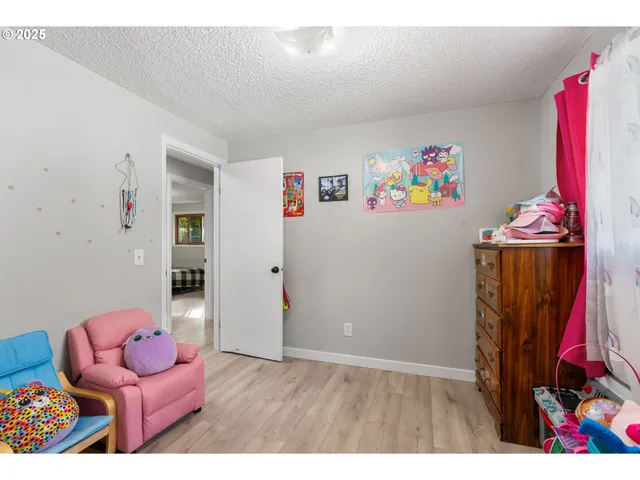a living room with furniture and a book shelf