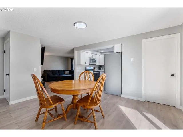 a dining room with furniture and window