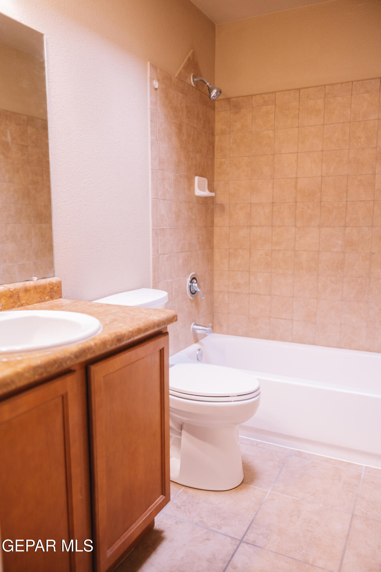 6824 Inca Dove El Paso, TX 79911 - Photo 7 of 18 a bathroom with a sink a toilet and shower