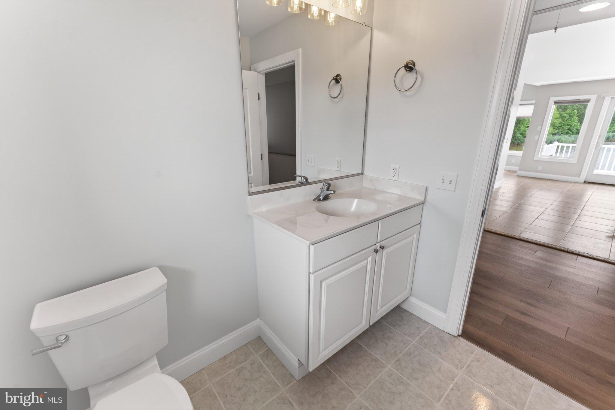 34029 Peppers Corner Road Millville, DE 19967 - Photo 48 of 101 Bright and airy modern bathroom retreat.