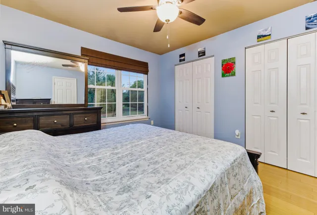 a bedroom with a large bed and a large window