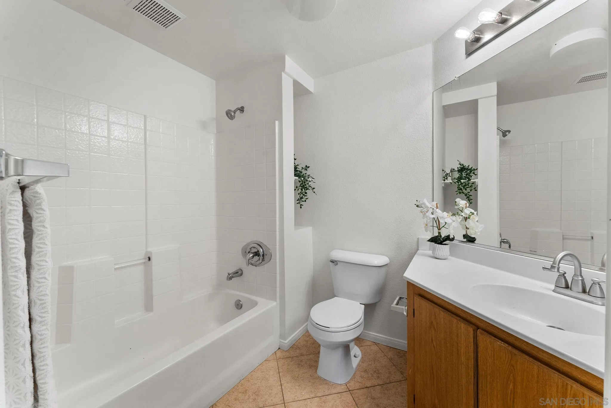 1441 Santa Lucia Road, Unit 615 Chula Vista, CA 91913 - Photo 18 of 31 a bathroom with a sink toilet and shower