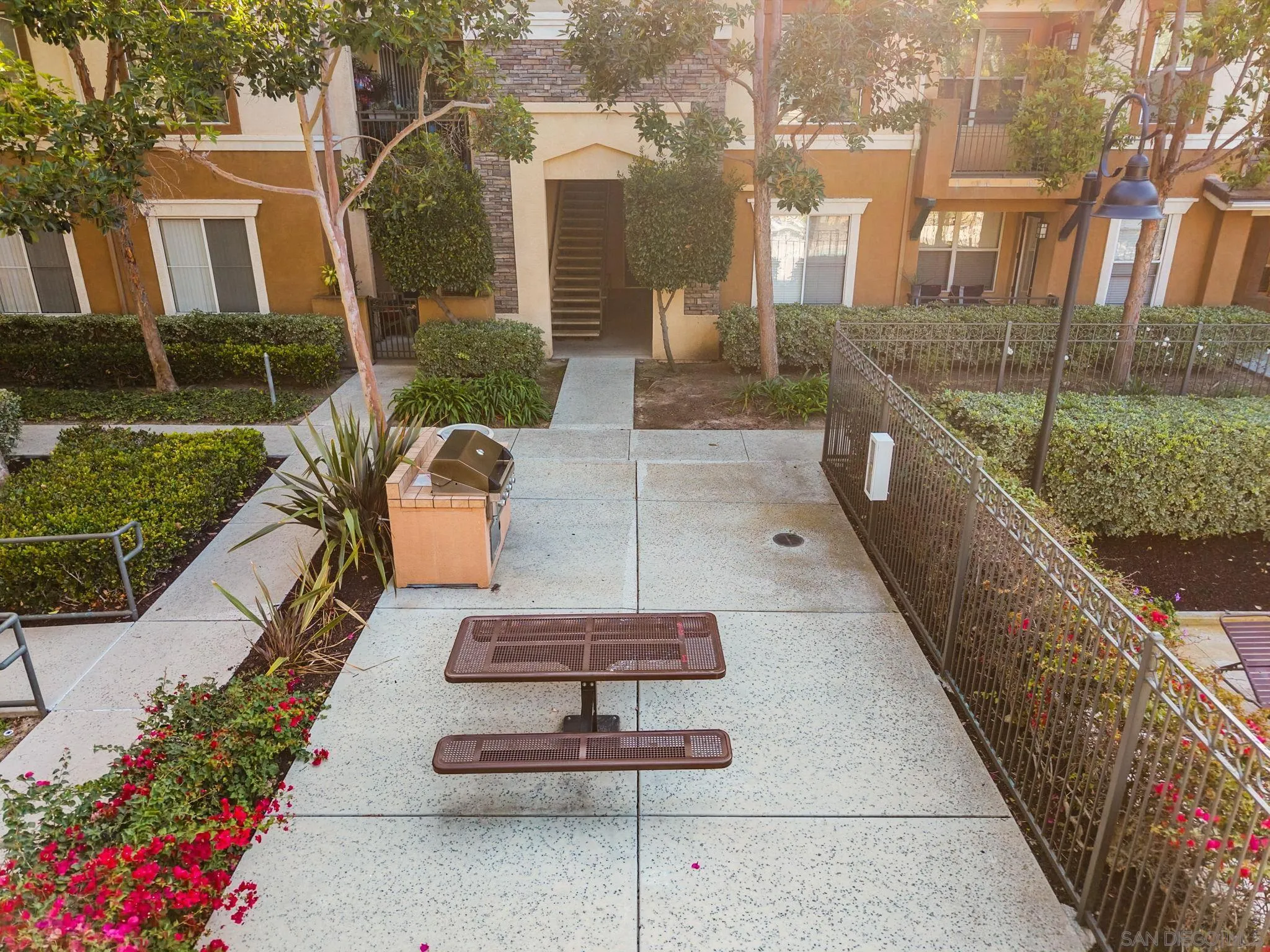 1441 Santa Lucia Road, Unit 615 Chula Vista, CA 91913 - Photo 29 of 31 a view of a patio with couches table and chairs and potted plants