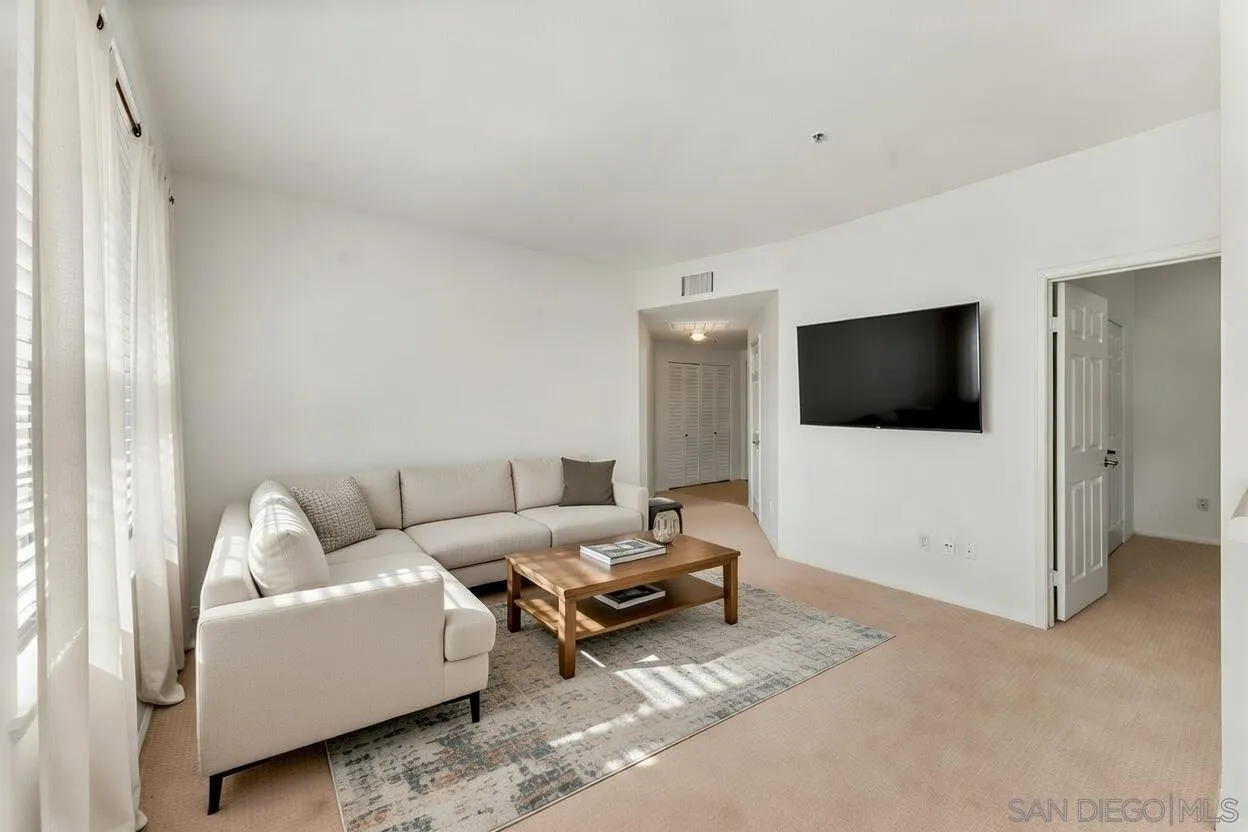 1441 Santa Lucia Road, Unit 615 Chula Vista, CA 91913 - Photo 3 of 31 a living room with furniture and a flat screen tv
