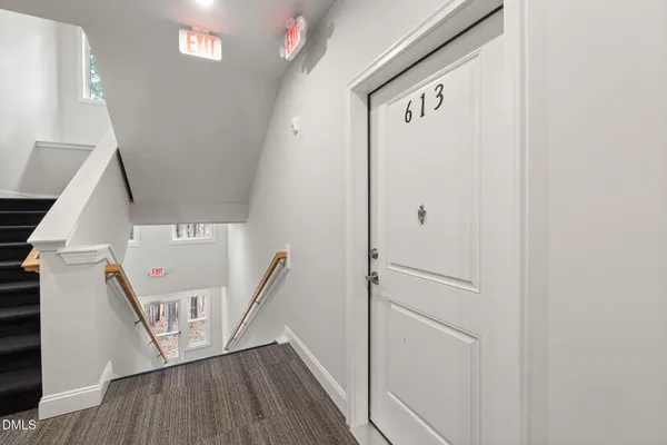 a view of a hallway with front door