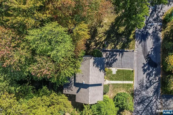 an aerial view of a house with a garden