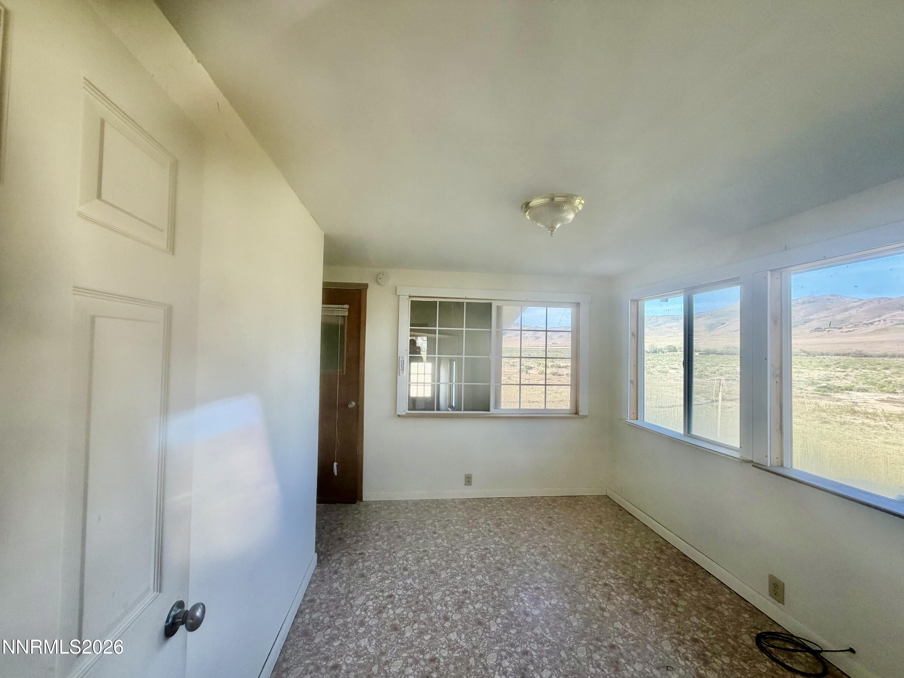3250 Youngberg Road Winnemucca, NV 89445 - Photo 12 of 49 a view of an empty room with a window