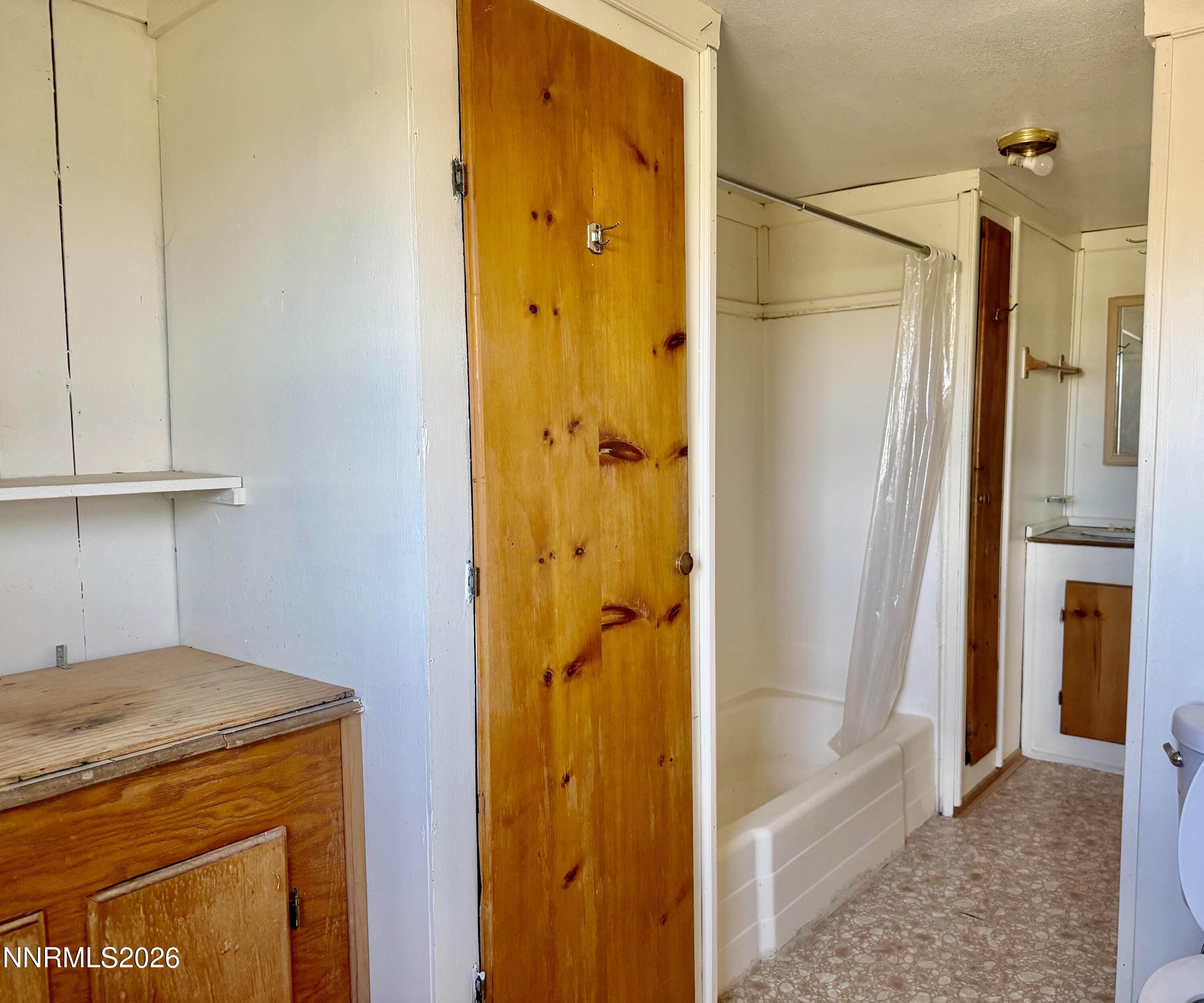 3250 Youngberg Road Winnemucca, NV 89445 - Photo 8 of 49 a bathroom with a tub and a shower