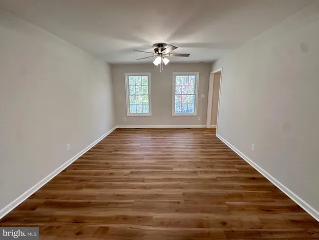 a bathroom with a tub a sink and shower