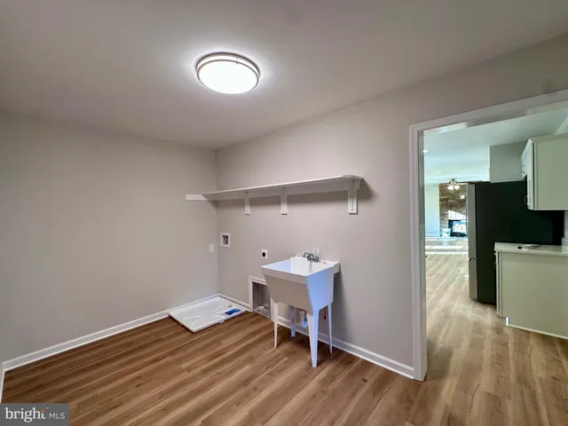 a view of an empty room and wooden floor