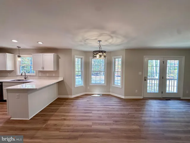 a view of an empty room with windows