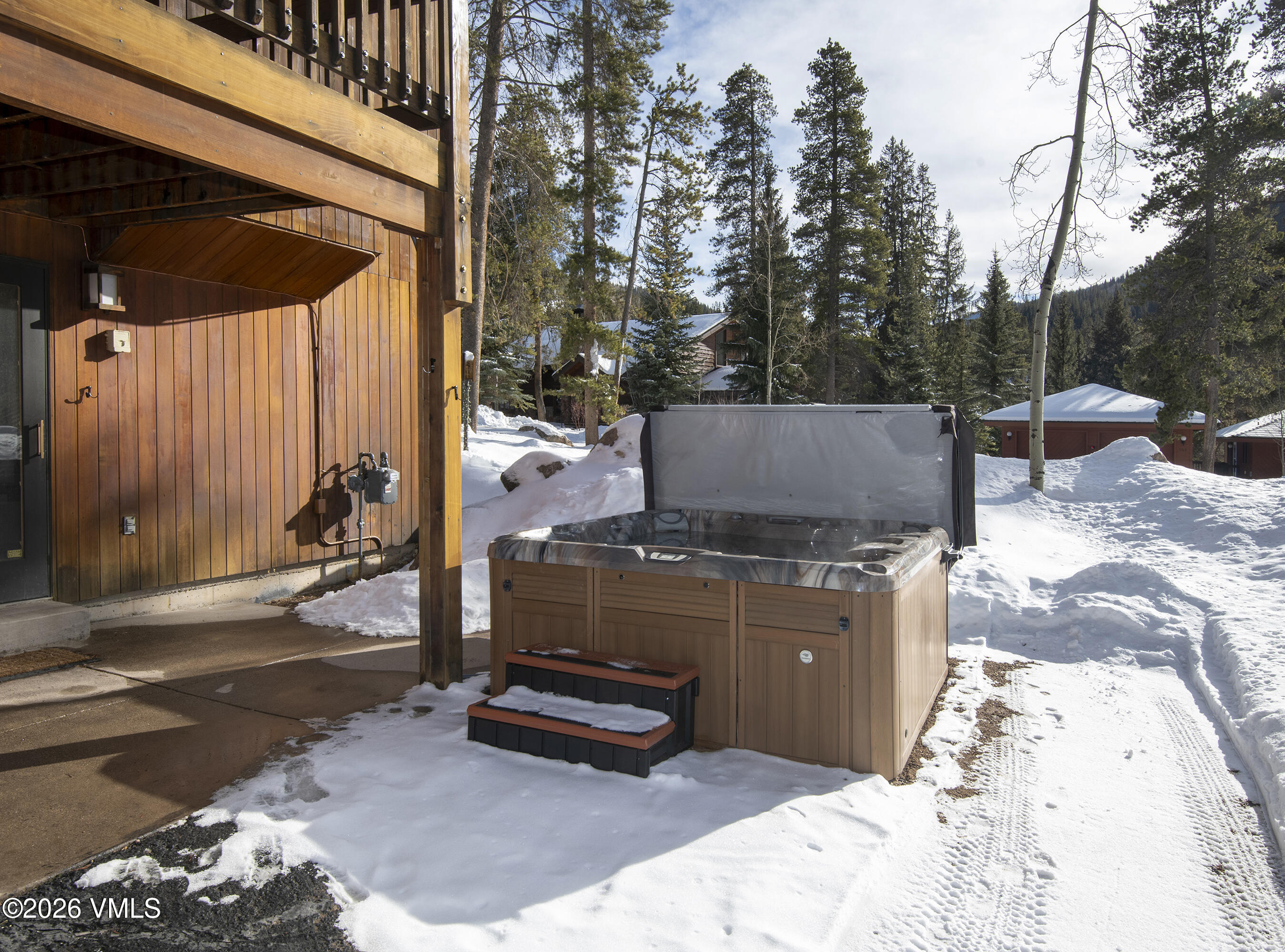 5159 Gore Circle Vail, CO 81657 - Photo 29 of 36 a view of a backyard with table and chairs under an umbrella