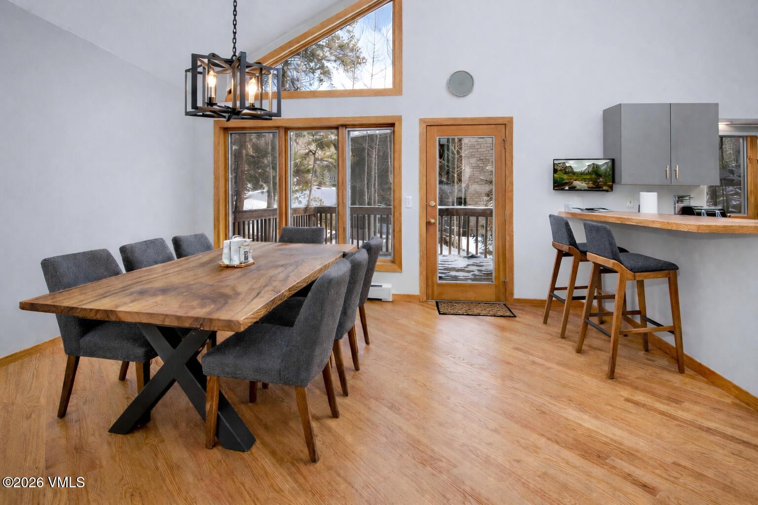 5159 Gore Circle Vail, CO 81657 - Photo 4 of 36 a view of a dining room with furniture window and wooden floor