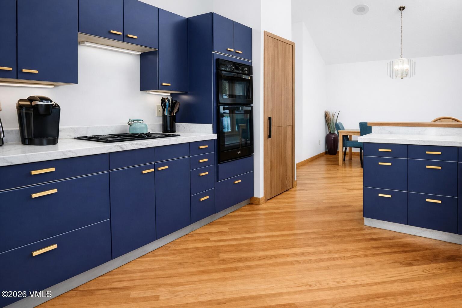 5159 Gore Circle Vail, CO 81657 - Photo 8 of 36 a kitchen with wooden cabinets and a sink