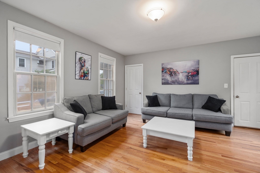 19 Winter Street Arlington, MA 02474 - Photo 18 of 39 a living room with furniture a rug and a window