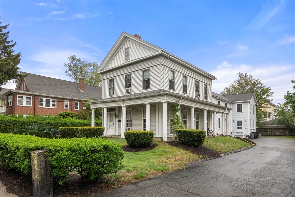 19 Winter Street Arlington, MA 02474 - Photo 2 of 39 a front view of a house with a yard