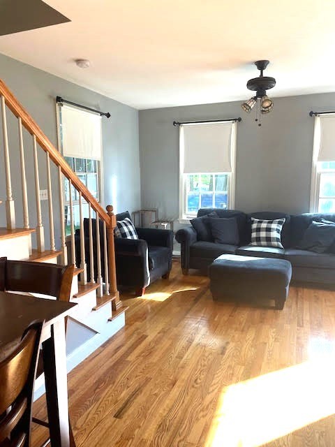 19 Winter Street Arlington, MA 02474 - Photo 35 of 39 a living room with furniture windows and a chandelier