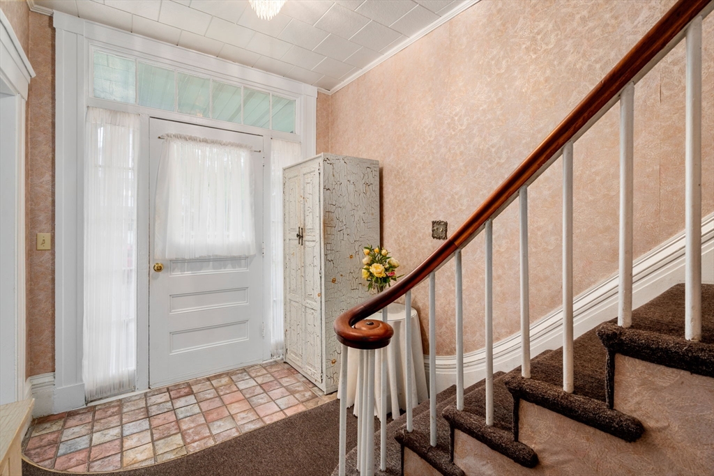 19 Winter Street Arlington, MA 02474 - Photo 4 of 39 a view of entryway with wooden floor and stairs