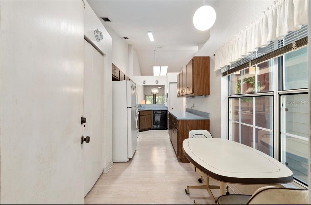 907 Southwest 51 Way Gainesville, FL 32607 - Photo 12 of 45 a kitchen with stainless steel appliances a refrigerator and a cabinets