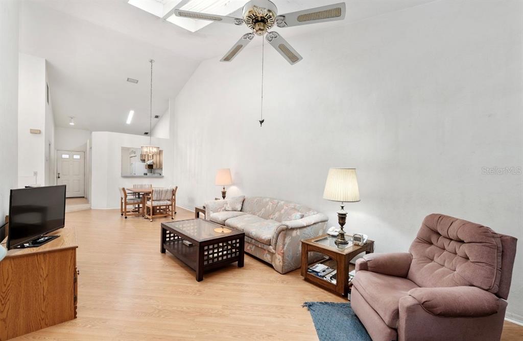 907 Southwest 51 Way Gainesville, FL 32607 - Photo 18 of 45 a living room with furniture a flat screen tv and a couch