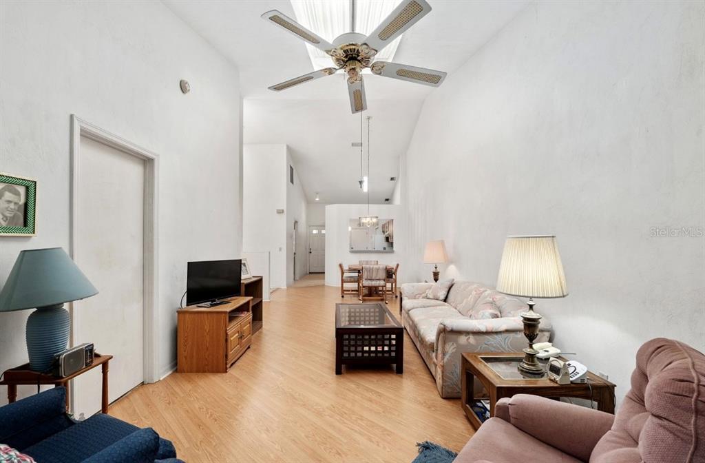 907 Southwest 51 Way Gainesville, FL 32607 - Photo 19 of 45 a room with furniture a rug and a lamp