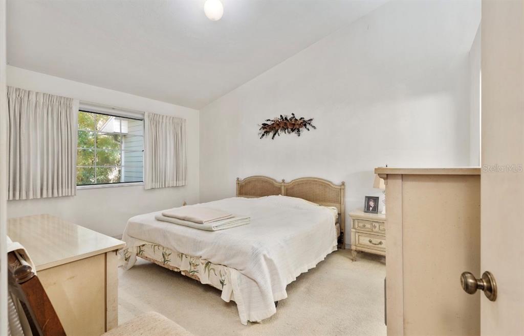 907 Southwest 51 Way Gainesville, FL 32607 - Photo 23 of 45 a bedroom with a bed and a window