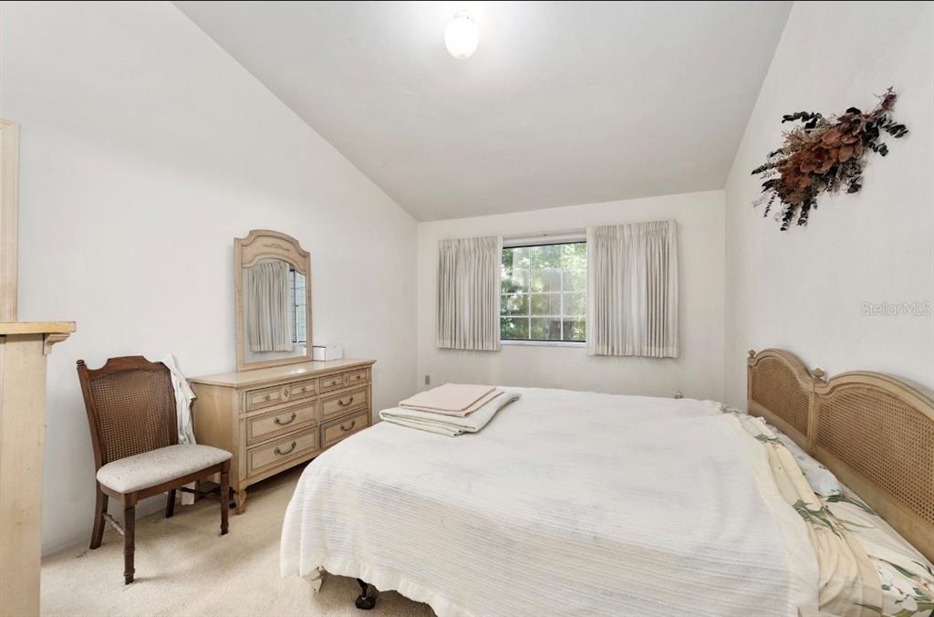 907 Southwest 51 Way Gainesville, FL 32607 - Photo 24 of 45 a bedroom with a bed chair and dresser