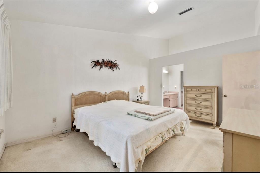 907 Southwest 51 Way Gainesville, FL 32607 - Photo 25 of 45 a bed room with a bed and a chair