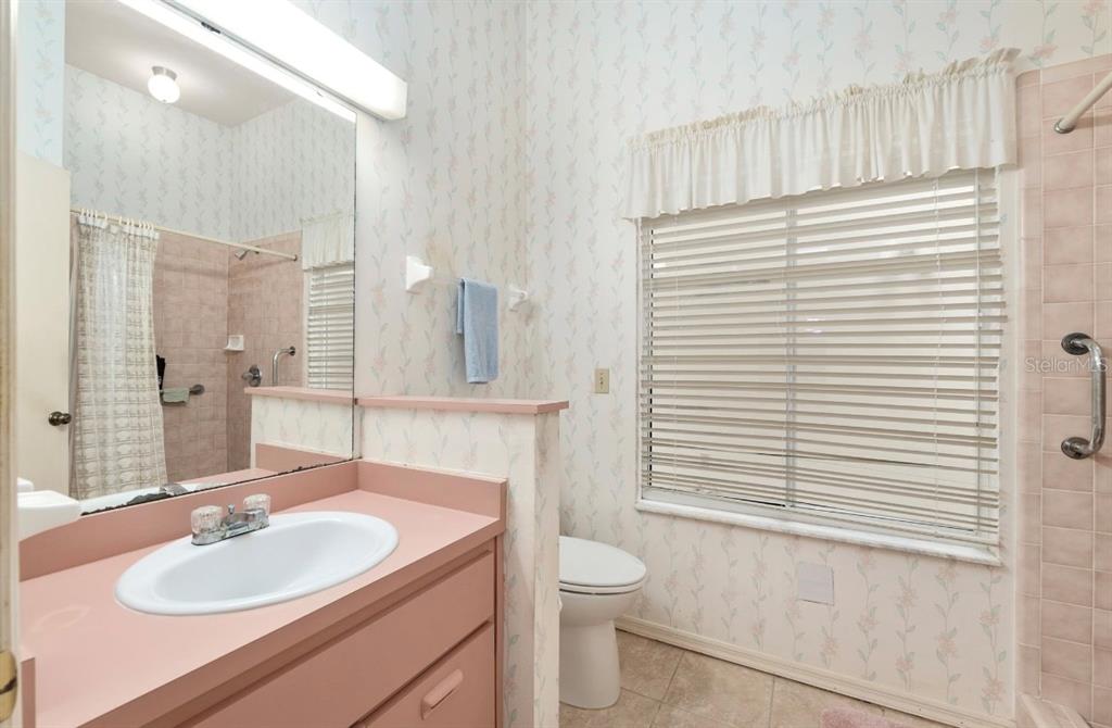 907 Southwest 51 Way Gainesville, FL 32607 - Photo 29 of 45 a bathroom with a sink and a mirror