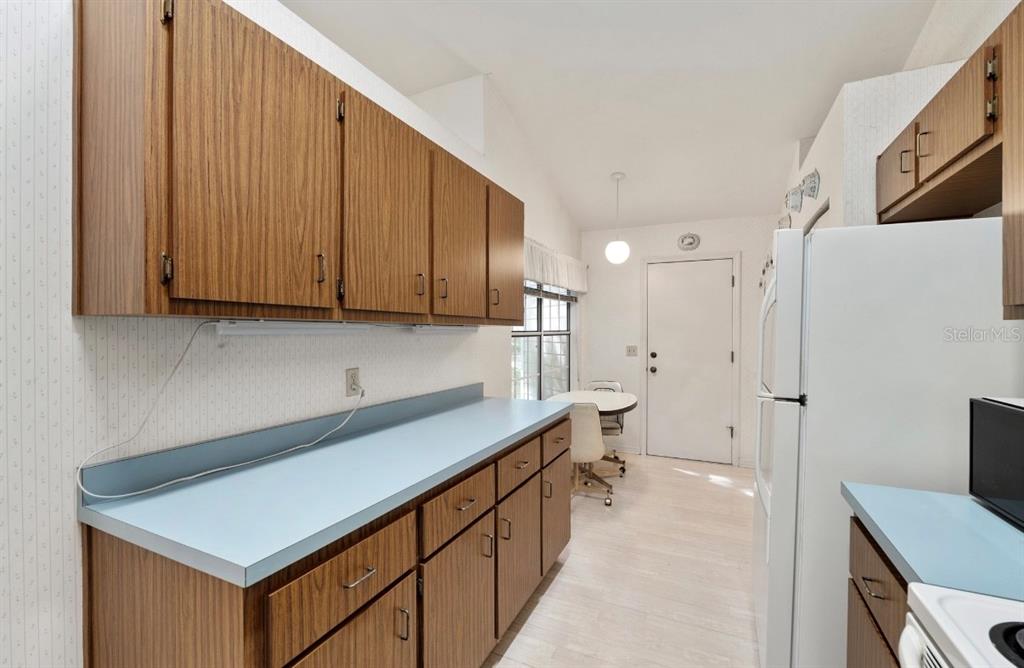 907 Southwest 51 Way Gainesville, FL 32607 - Photo 8 of 45 a kitchen with stainless steel appliances a sink dishwasher a refrigerator and cabinets