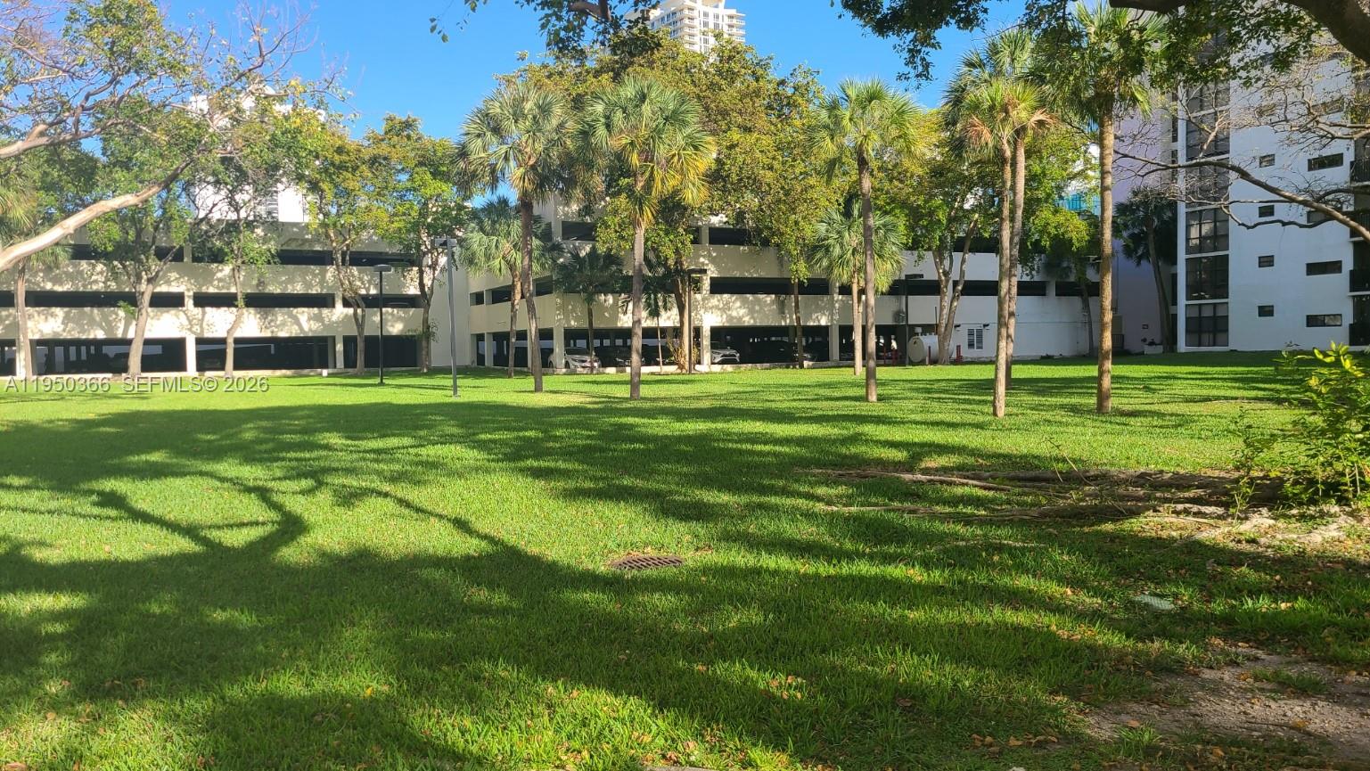 16909 North Bay Road, Unit 806 Sunny Isles Beach, FL 33160 - Photo 26 of 27 a big yard with palm trees