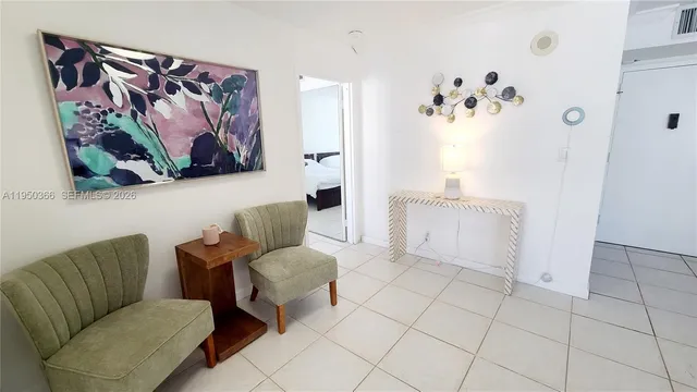a view of a livingroom with furniture and natural light