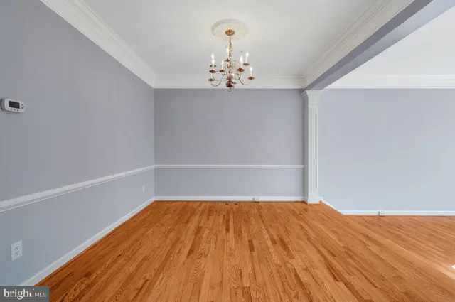 a view of a kitchen with kitchen island stainless steel appliances wooden floor and window