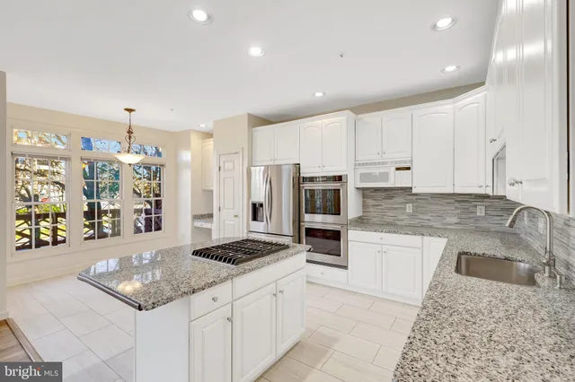 a kitchen with a stove and a refrigerator