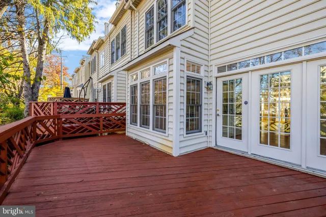a view of an entryway with wooden floor and windows