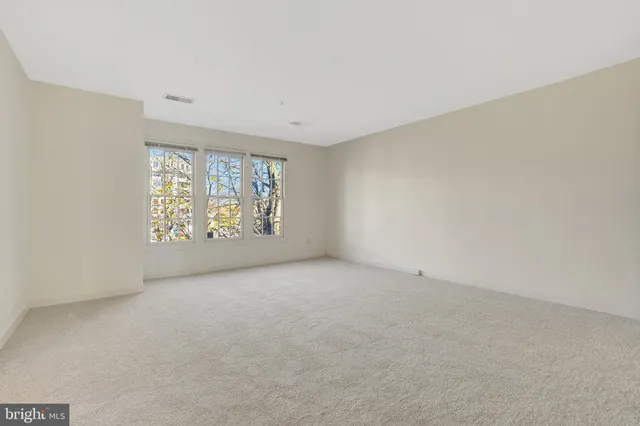 a bathroom with a double vanity sink mirror and shower