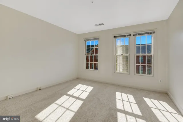 a bathroom with a toilet sink vanity tub and shower
