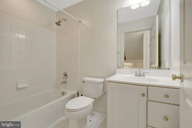 a view of staircase with railing and a window