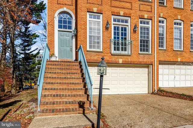 a front view of a house with a garage